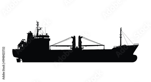 A striking black silhouette of a large cargo ship at sea