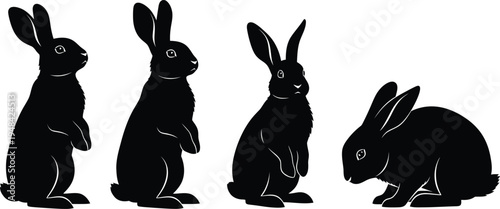 Four black silhouette rabbits on white background