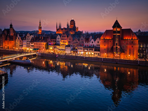 Beautiful old town of Gdansk with historic architecture over the Motlawa river at dusk, Poland