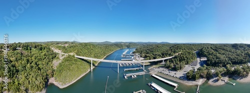 Wallpaper Mural Aerial View of the Lakeside Sunset Marina Resort on Dale Hollow Lake With Highway 111 Bridge, Boats and Forested Shoreline, Calm Water on a Sunny Day, Monroe, Tennessee, USA. Torontodigital.ca