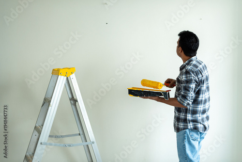 Photography Man painting wall interior home