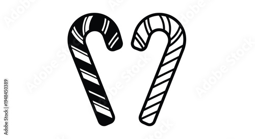 Two black and white striped candy canes facing each other