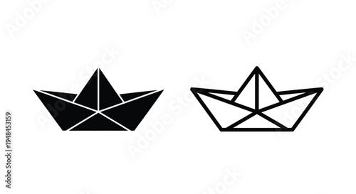 Two paper boats one solid black and one with white interior