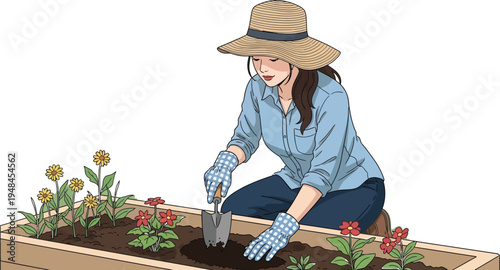 Woman wearing a straw hat and gloves kneels to plant flowers in a wooden raised garden bed.