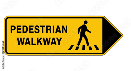 A pedestrian walks on a designated walkway marked with a sign