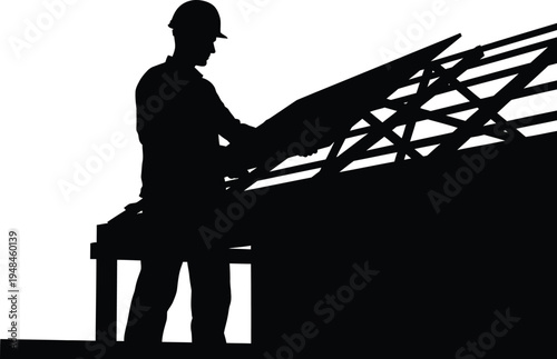 Construction worker silhouette working on building roof structure