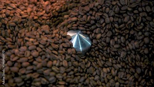 Coffee beans rotate and tumble in a roasting machine, achieving a perfect medium roast for rich flavor and aroma, representing fresh preparation - stock video