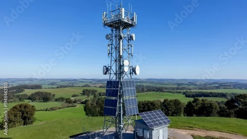 Cellular communication tower with solar panel system providing wireless internet and mobile network connectivity for remote areas