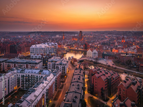 Beautiful old town of Gdansk with historic architecture over the Motlawa river at dusk, Poland