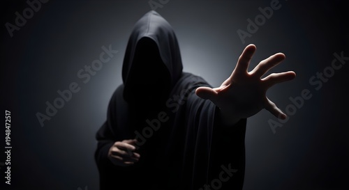 Mysterious Hooded Figure Reaching Out In The Darkness