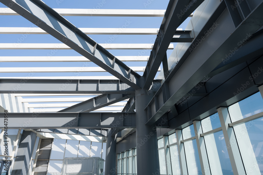 Fototapeta premium Modern architectural steel structure roof with glass curtain wall and geometric framework