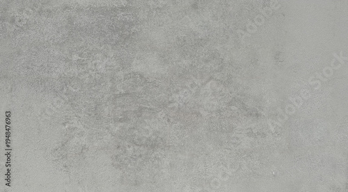 Neutral gray polished concrete texture with subtle mottled pattern and industrial surface, modern background.
