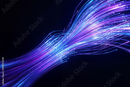 Blue and purple fiber optic cables with light trails on black