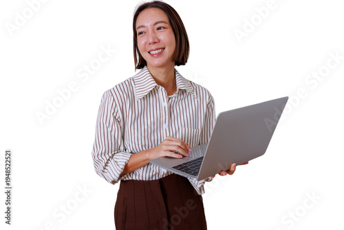 Confident young asian woman holding a modern laptop, smiling and looking away, standing on a transparent background