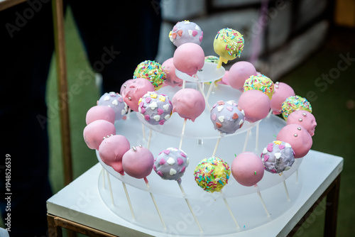 Elegant pink sweet table setup for a birthday celebration featuring beautifully decorated cake pops and delicate desserts in soft pastel tones. The perfect inspiration for a glamorous and fairy-tale b