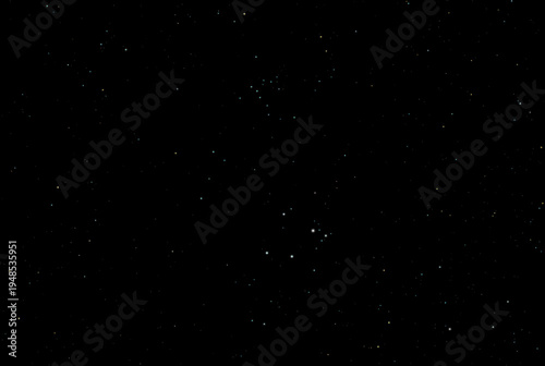 Wide angle photograph of some of the stars and star clusters (star field) surrounding the Orion Nebula (M42) in the constellation Orion.