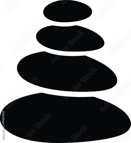 Stack of four smooth stones balanced on a white rocks pebbles