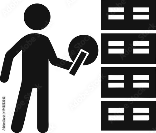 Worker loading a circular item into a stack of storage servers or data racks