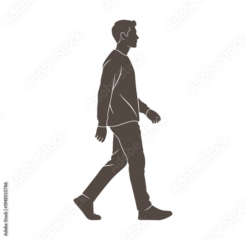 man walking alone in a suit and looking ahead to the right side