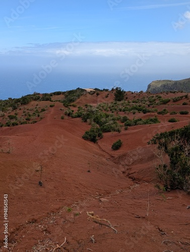 Red Sand Landscape with Blue Sky and Volcanic Terrain on La Gomera