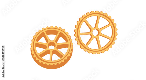 Pair of wagon wheel shaped pasta pieces known as rotelle or ruote in a warm golden orange color on white background.