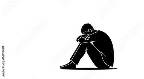 Silhouette of a sad person sitting alone, head in hands, feeling depressed and isolated