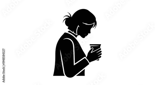 Silhouette of a woman holding a coffee cup, enjoying a moment of calm.