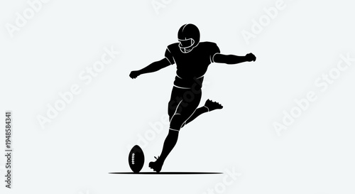 Silhouette of American Football Player Kicking Ball During Game