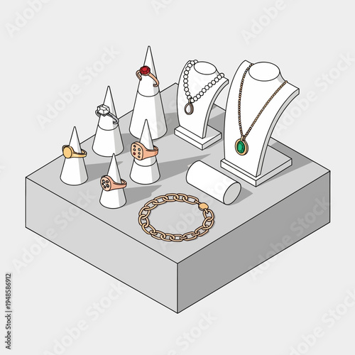 Jewelry display featuring rings, necklaces, and a bracelet arranged on a gray platform.