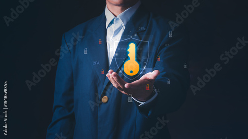 Concept of cybersecurity, 2FA authentication, and secure login access for business privacy, a professional businessman holding a digital golden key and shield for data protection.