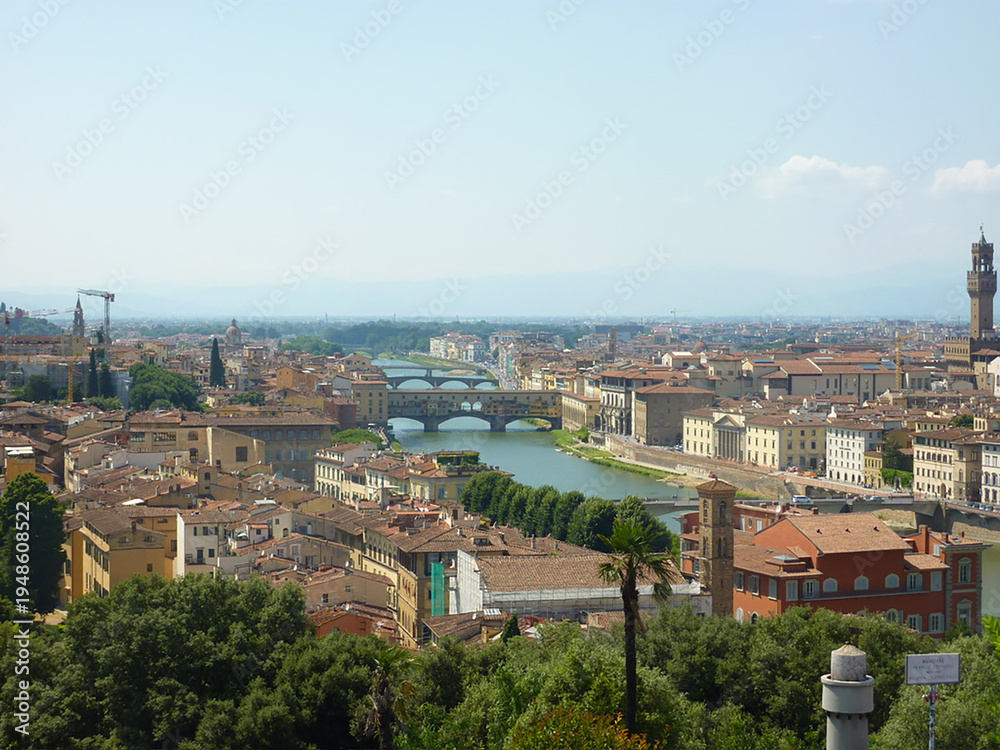Fototapeta premium Aerial panorama of Florence featuring the Arno River, Ponte Vecchio, and Palazzo Vecchio