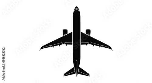 Black silhouette of a passenger airplane viewed from directly above