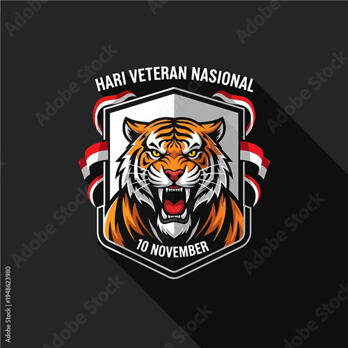 Tiger busting shield with ribbon and text 10 November for National Veteran Day