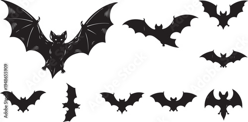 Collection of black bat silhouettes in various flying positions