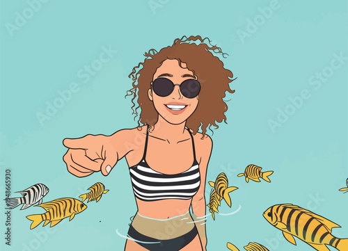 Woman wearing sunglasses points at the viewer while swimming with colorful fish in bright blue water