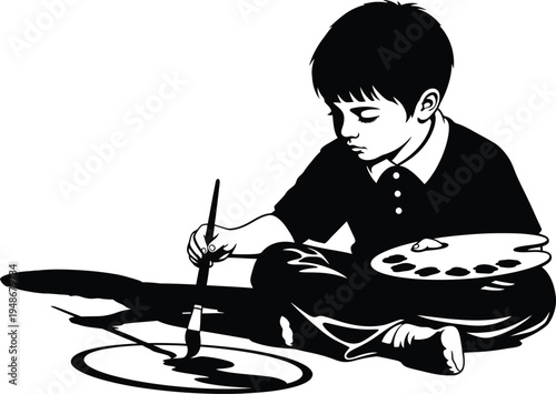 Young artist at work with paintbrush and palette