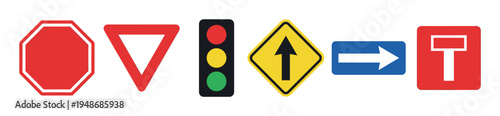 Row of various road and traffic signs, including stop, yield, traffic light, and directional arrows, providing essential navigation information.