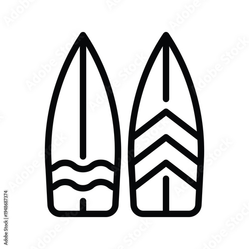 Two surfboards standing upright with distinct patterns.