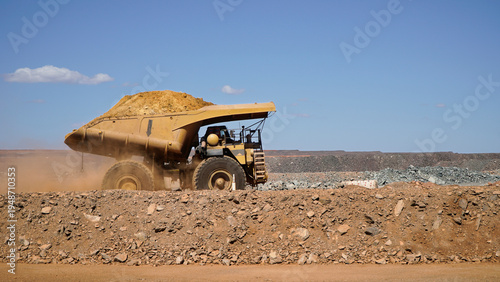 Western Australia mining town of Kalgoorlie a heavy mining dump truck hauling dirt across open pit