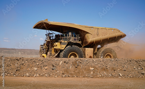 Western Australia mining town of Kalgoorlie a heavy mining dump truck hauling dirt across open pit