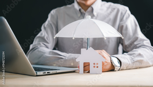 Принти на полотні Business man demonstrating home insurance concept, protecting house property mod