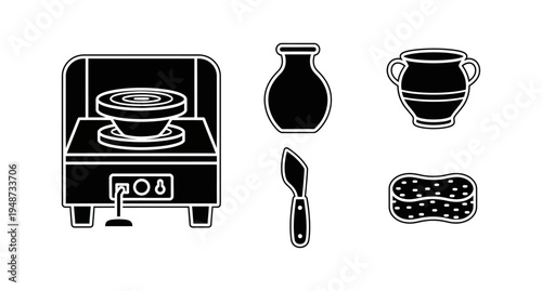 Collection of pottery tools and equipment, including a pottery wheel, vase, sponge, and knife
