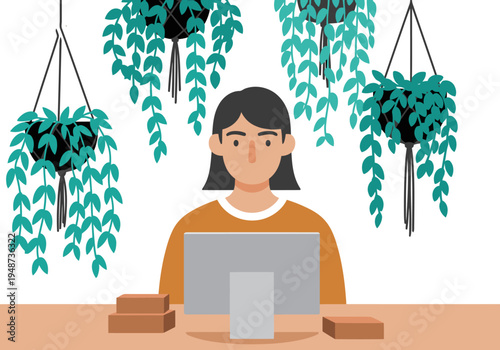 A young professional works at a desk surrounded by hanging plants in a modern workspace. The scene evokes a calm and productive atmosphere.