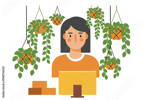 A young professional works at a desk with a computer, surrounded by lush hanging plants. A modern workspace design featuring greenery and a bright, inviting atmosphere.