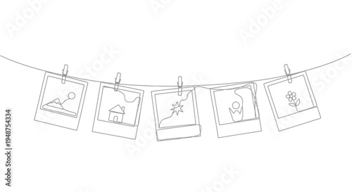 Instant photo prints hanging on a line with clothespins