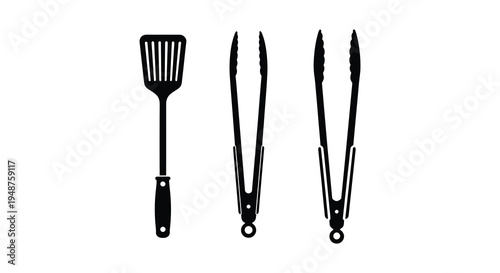 Black kitchen utensils including a spatula and two sets of tongs in a dark silhouette