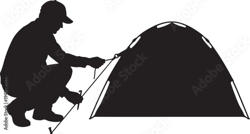 Silhouette of a Man Setting Up a Camping Tent for Outdoor Recreation
