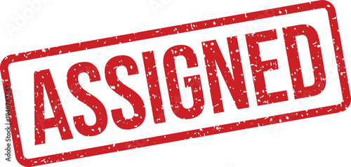 Distinctive red grunge stamp with the word Assigned prominently displayed within a textured border on a bright white surface