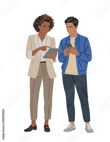 Two people stand close, engaged with digital devices. One holds a tablet, the other grips a smartphone. They face each other, focused on screens. Casual attire suggests everyday collaboration