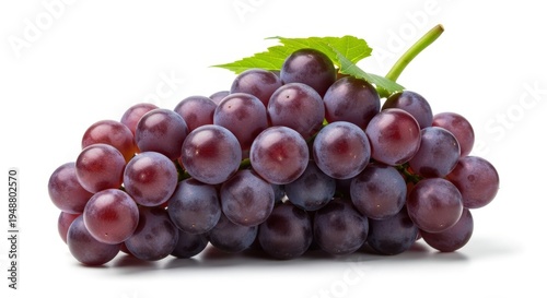 A vibrant bunch of fresh red grapes with a green leaf, isolated on a clean white background, showcasing their plump and juicy appearance.
